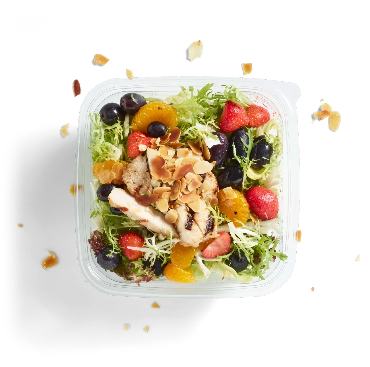 Salat mit Früchten und Hähnchenstreifen, freigestellt von oben